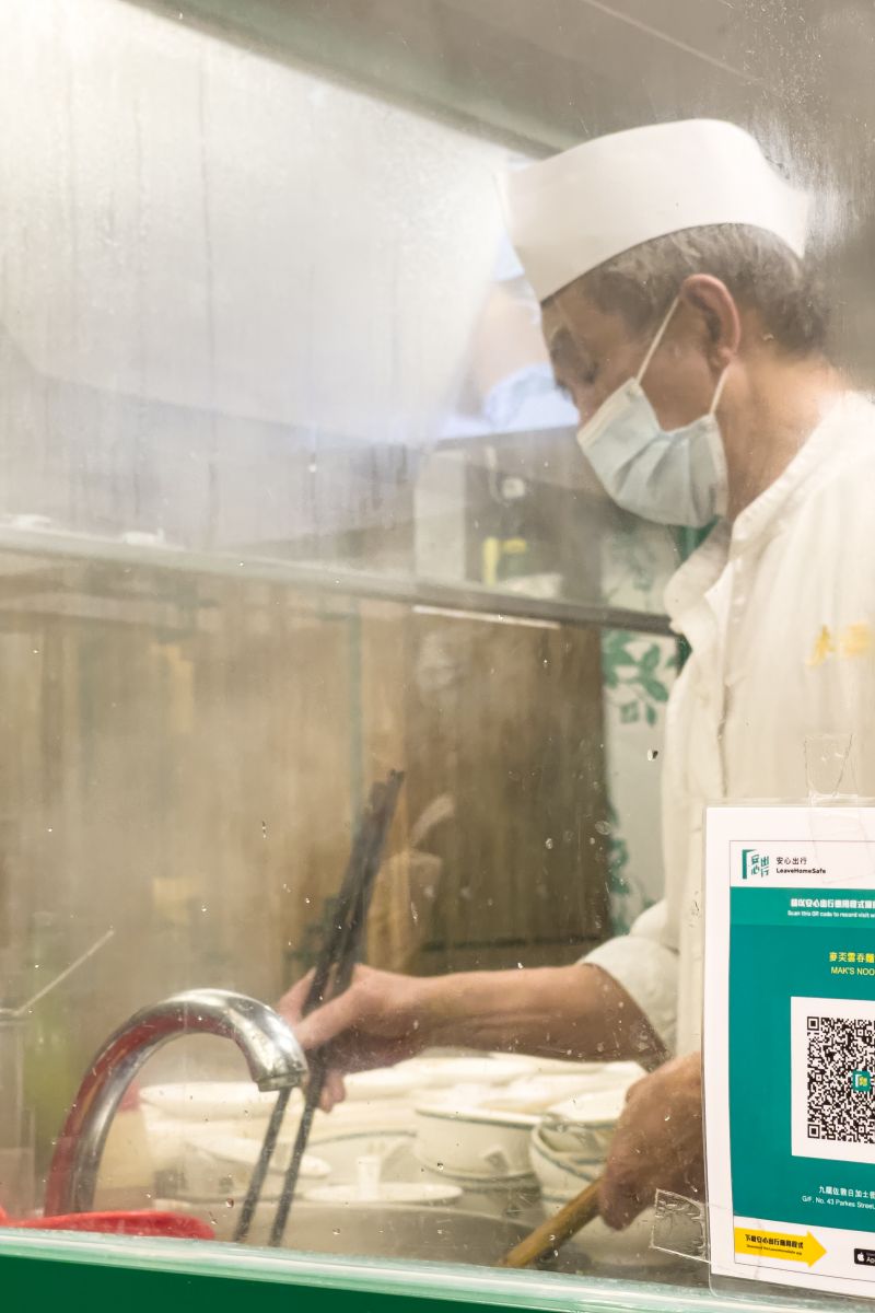 An experienced chef showcasing how a wonton noodle is made
