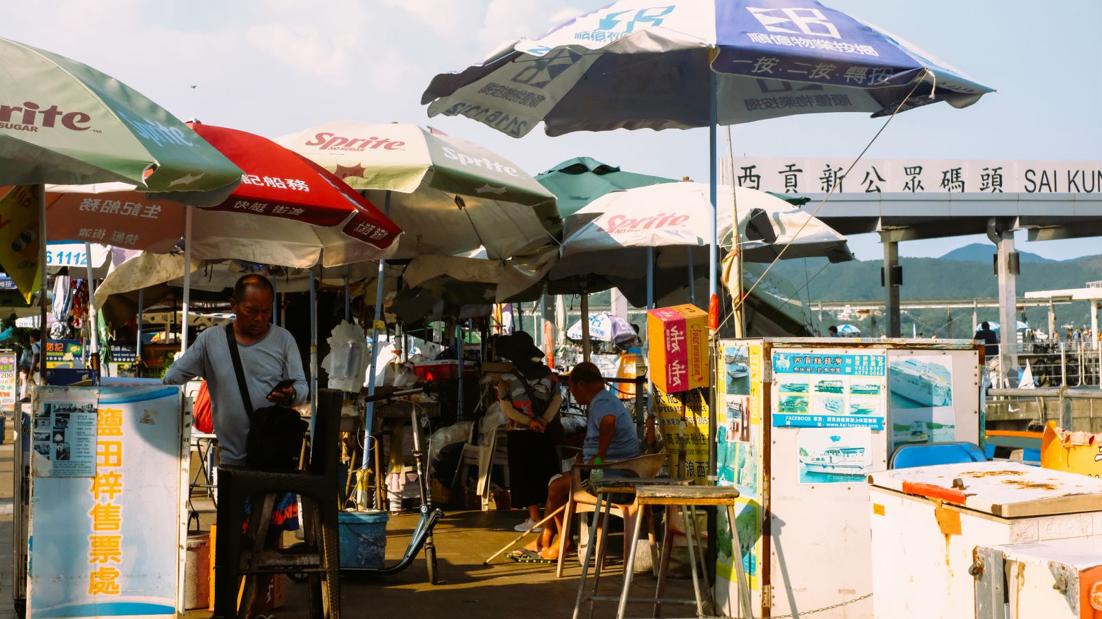 Different boat operators sell tickets next to the pier