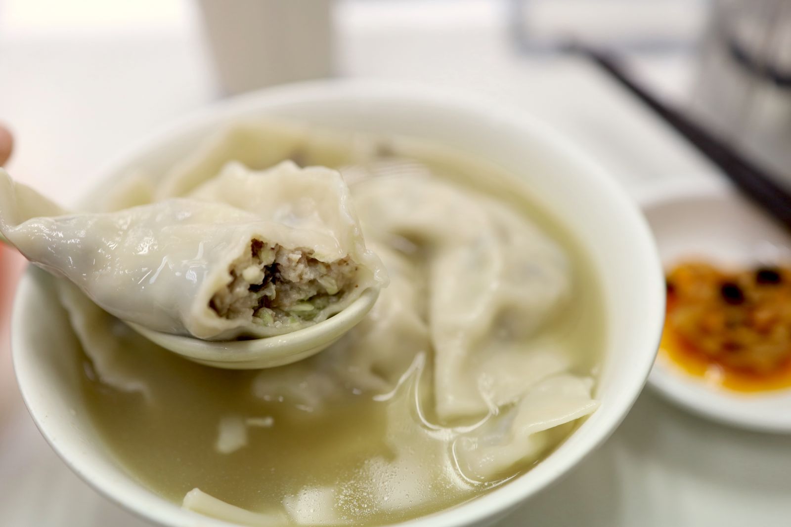 Boiled dumplings with tasty soup.