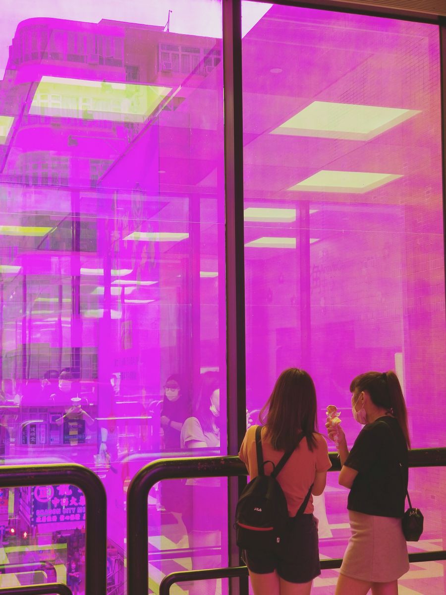 Two youngsters enjoying street food on level 2