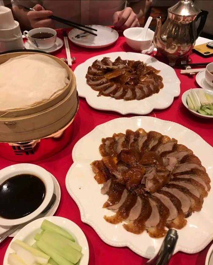 Wrap your duck in soft pancake with onion, cucumber and bean sauce